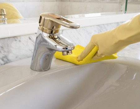 Upholstery cleaning equipment preparing to clean a lounge sofa